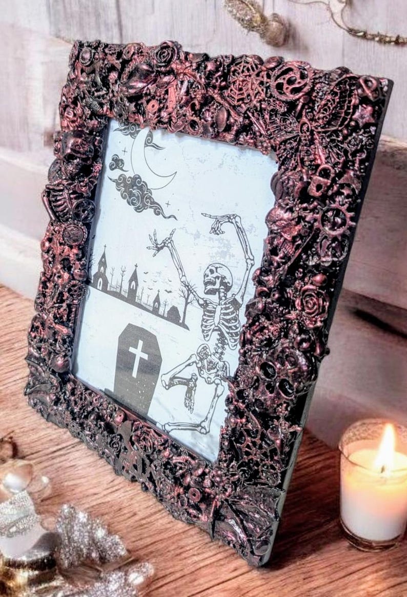 8 x 6" freestanding portrait picture photo frame. Hand embellished gothic charms blackened metallic rose pink crow skulls skeletons spooky