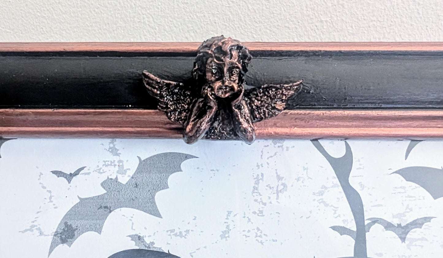 10 x 8" portrait freestanding picture photo frame. Copper/bronze tone and black with cherubs and decorative corner detailing goth home gift