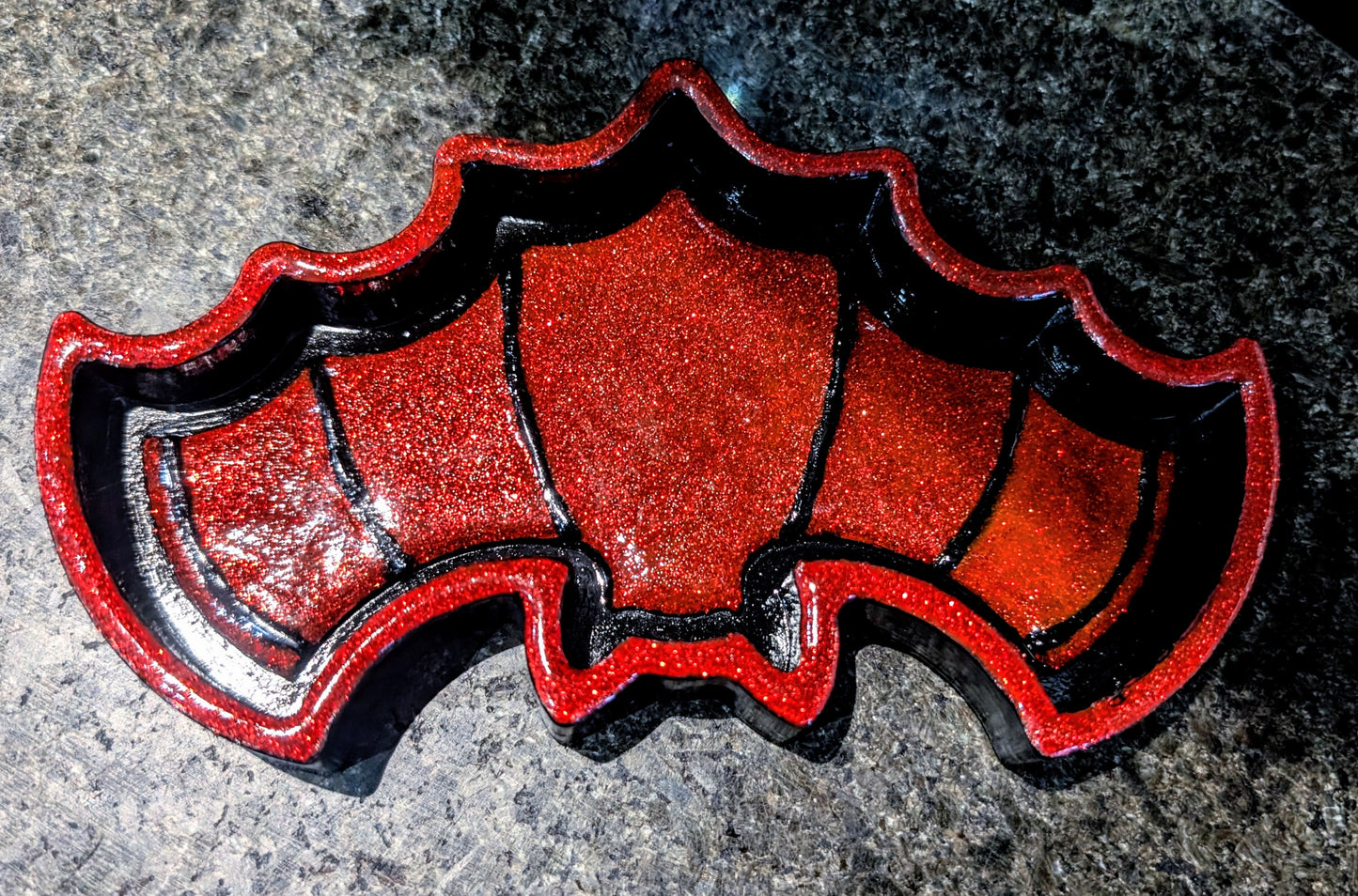 Hand-cast black with red glitter bat shaped jewellery trinket dish tray. Gothic home decor gift