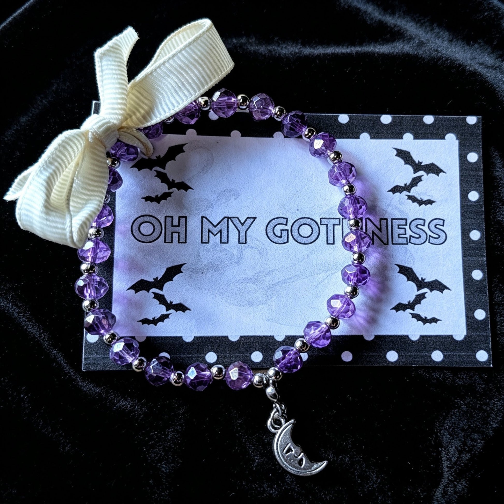 Handmade purple and silver beaded bracelet with a crescent moon pendant. - Oh My Gothness