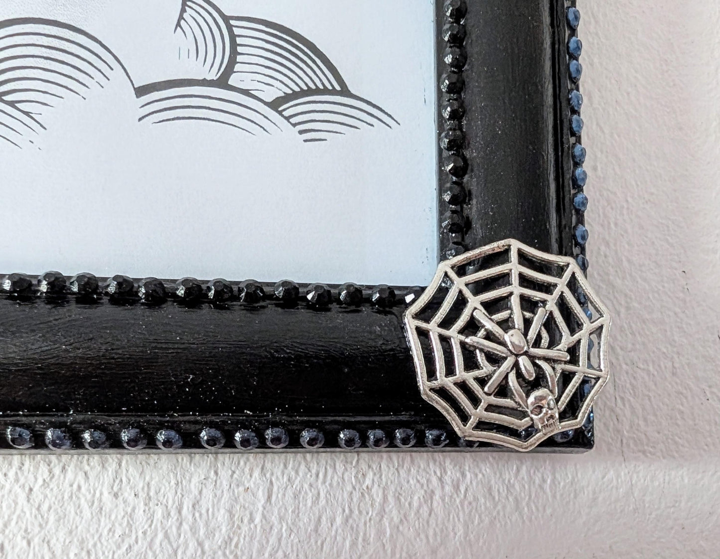 8 x 10" landscape gothic inspired picture photo frame hand painted black. Embellished with smokey blue/grey + black gems, spiders + cobweb