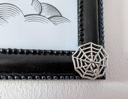 8 x 10" landscape gothic inspired picture photo frame hand painted black. Embellished with smokey blue/grey + black gems, spiders + cobweb