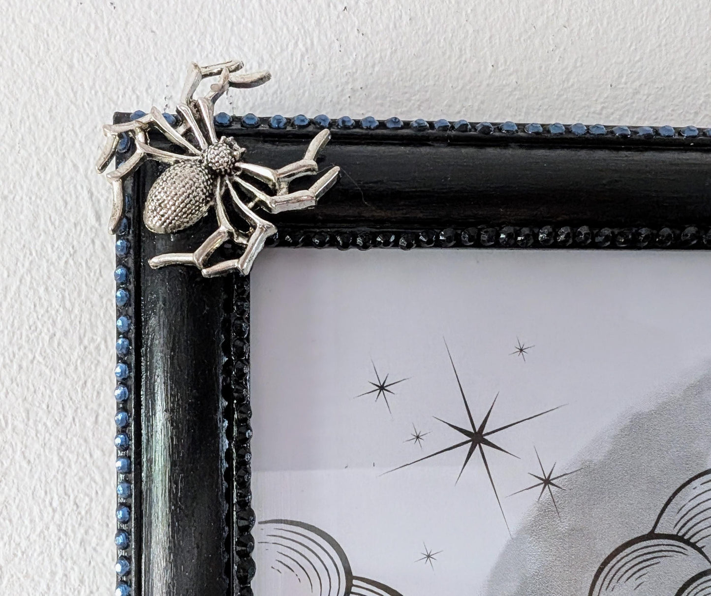 8 x 10" landscape gothic inspired picture photo frame hand painted black. Embellished with smokey blue/grey + black gems, spiders + cobweb