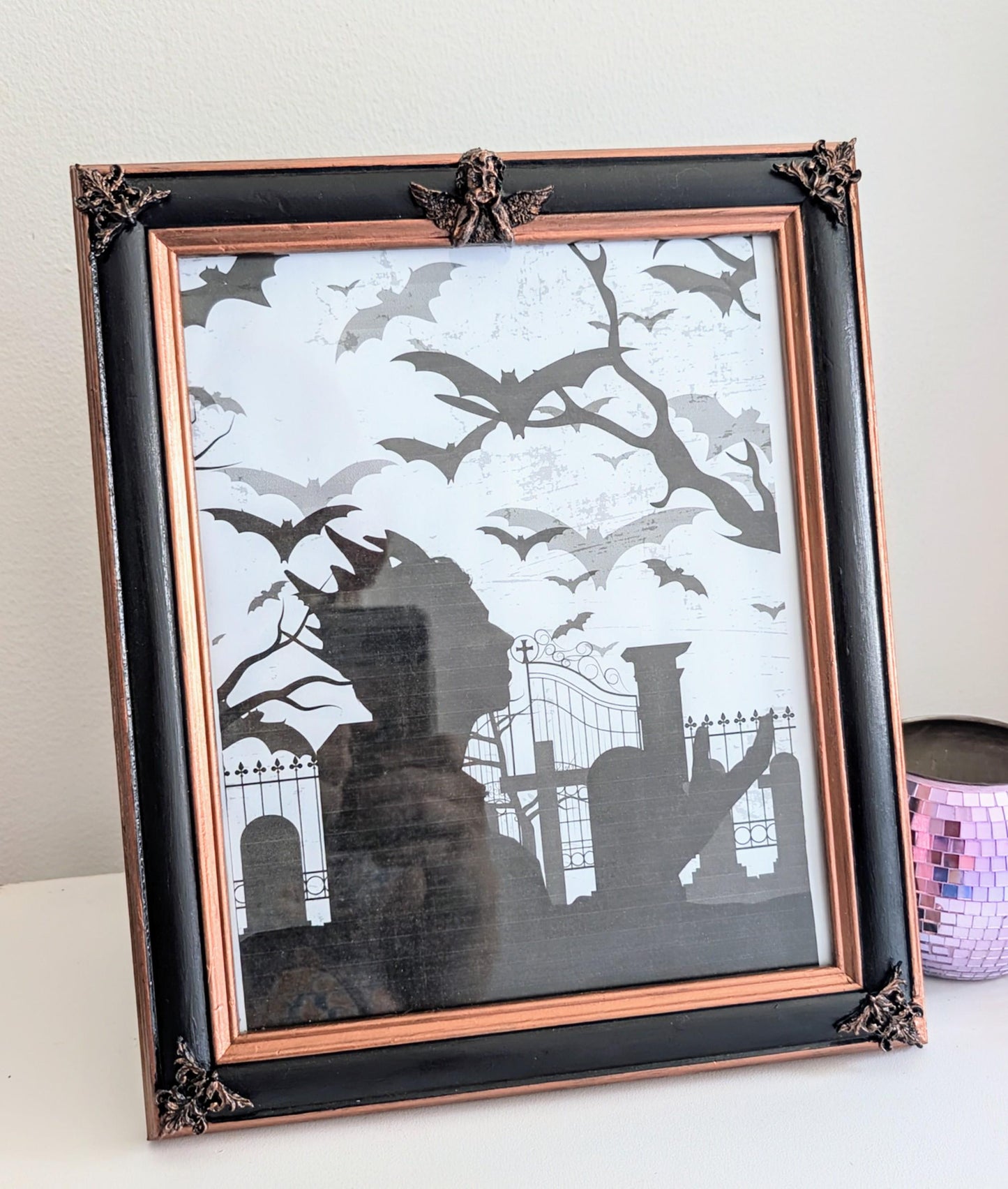 10 x 8" portrait freestanding picture photo frame. Copper/bronze tone and black with cherubs and decorative corner detailing goth home gift