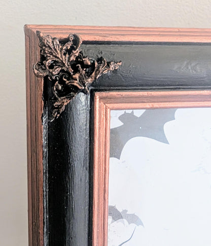 10 x 8" portrait freestanding picture photo frame. Copper/bronze tone and black with cherubs and decorative corner detailing goth home gift