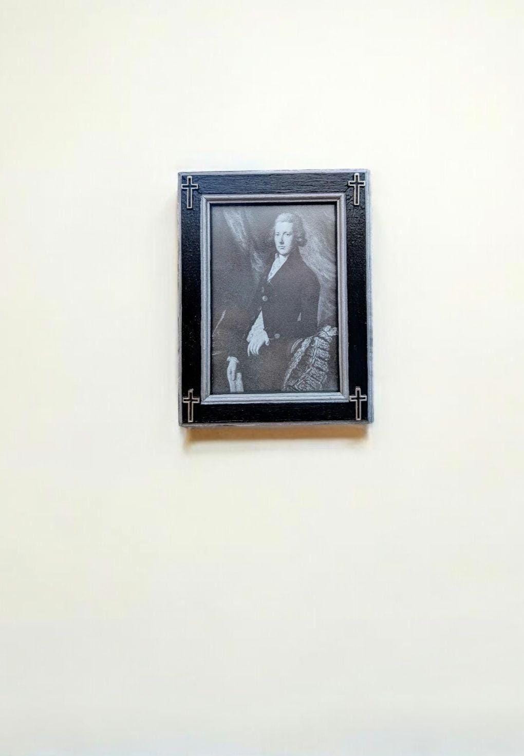 Small 3.5" x 5" wall hanging gothic photo frame. Hand painted black and silver with hollow corner crosses. Gothic inspired home decor gift