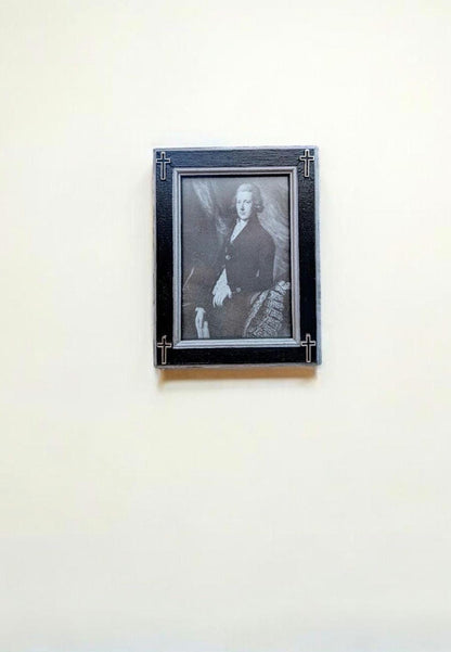 Small 3.5" x 5" wall hanging gothic photo frame. Hand painted black and silver with hollow corner crosses. Gothic inspired home decor gift