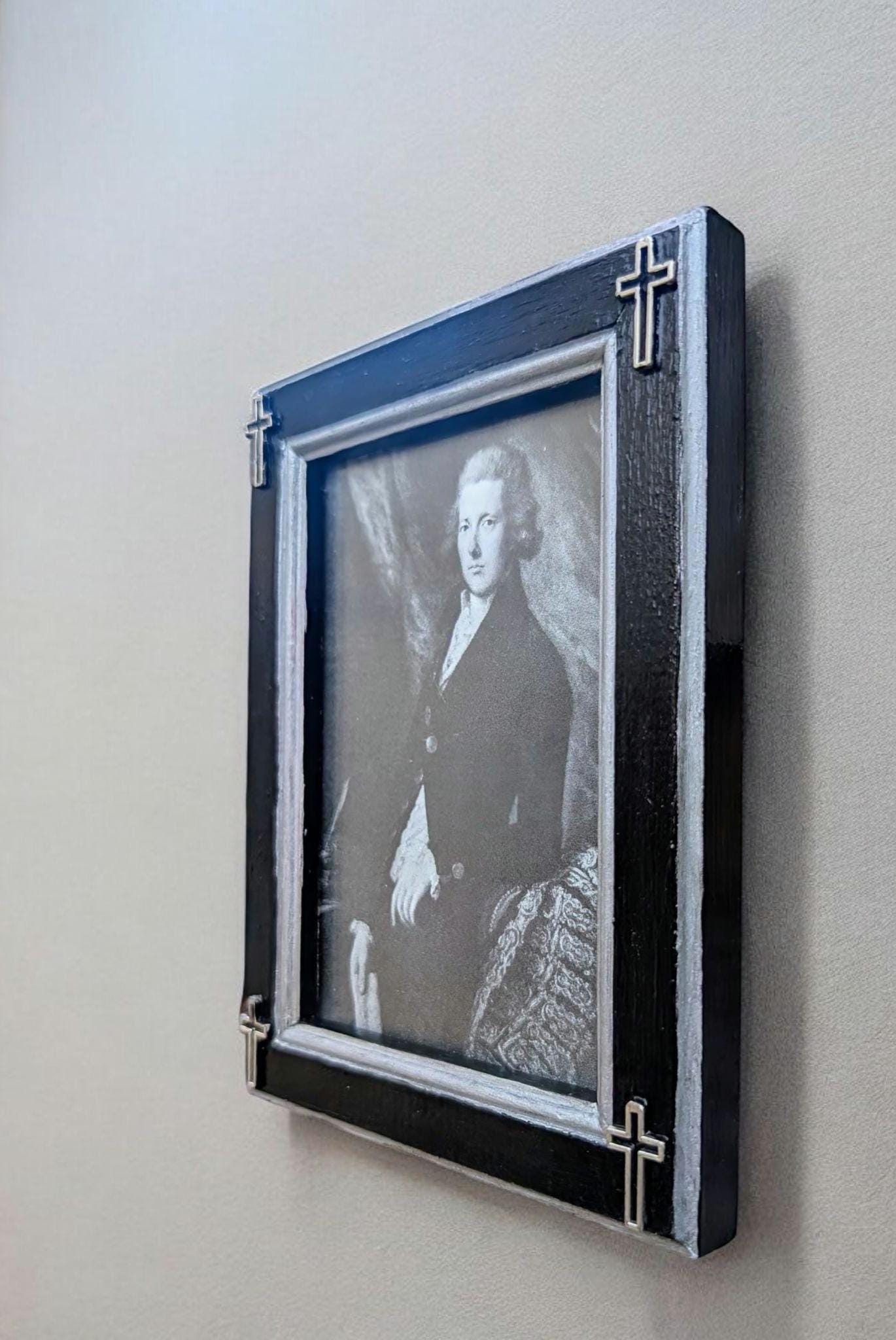 Small 3.5" x 5" wall hanging gothic photo frame. Hand painted black and silver with hollow corner crosses. Gothic inspired home decor gift