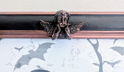 10 x 8" portrait freestanding picture photo frame. Copper/bronze tone and black with cherubs and decorative corner detailing goth home gift