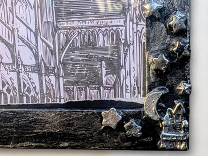 9 x 7" landscape wall hanging photo frame. Hand painted and embellished with gothic charms, stars, spooky house, crescent moon. House gift