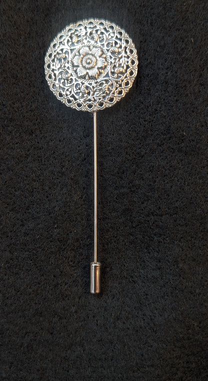 Hand made round decorative floral silver-tone metal lapel pin.
